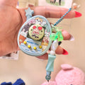 Pocket Pets virtual pet toy front view with macaron charm and star charm