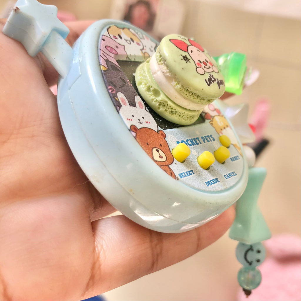 Pocket Pets virtual pet toy full front view showing cartoon animal artwork