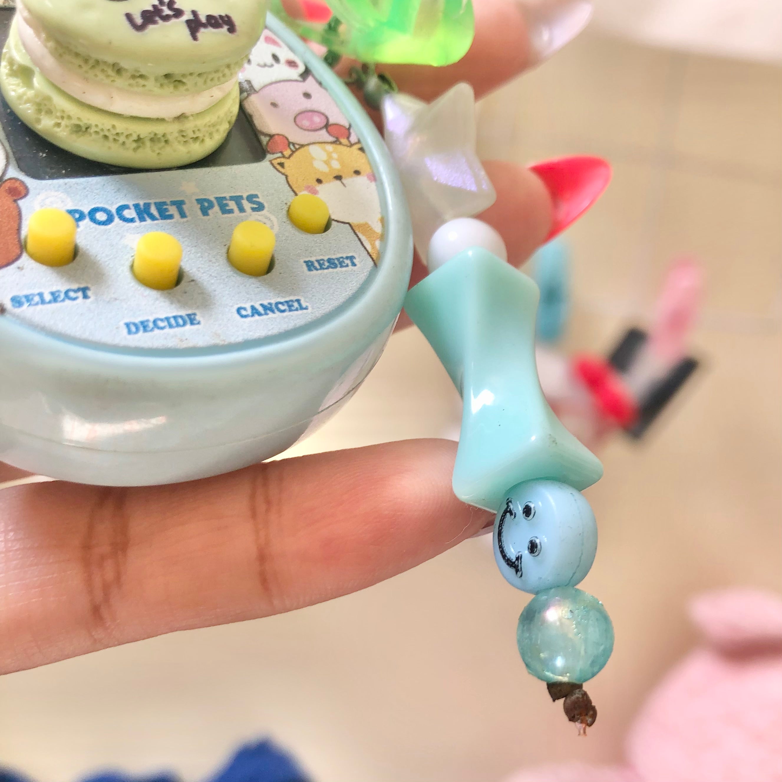 Pocket Pets virtual pet toy mint blue ghost pendant charm close-up