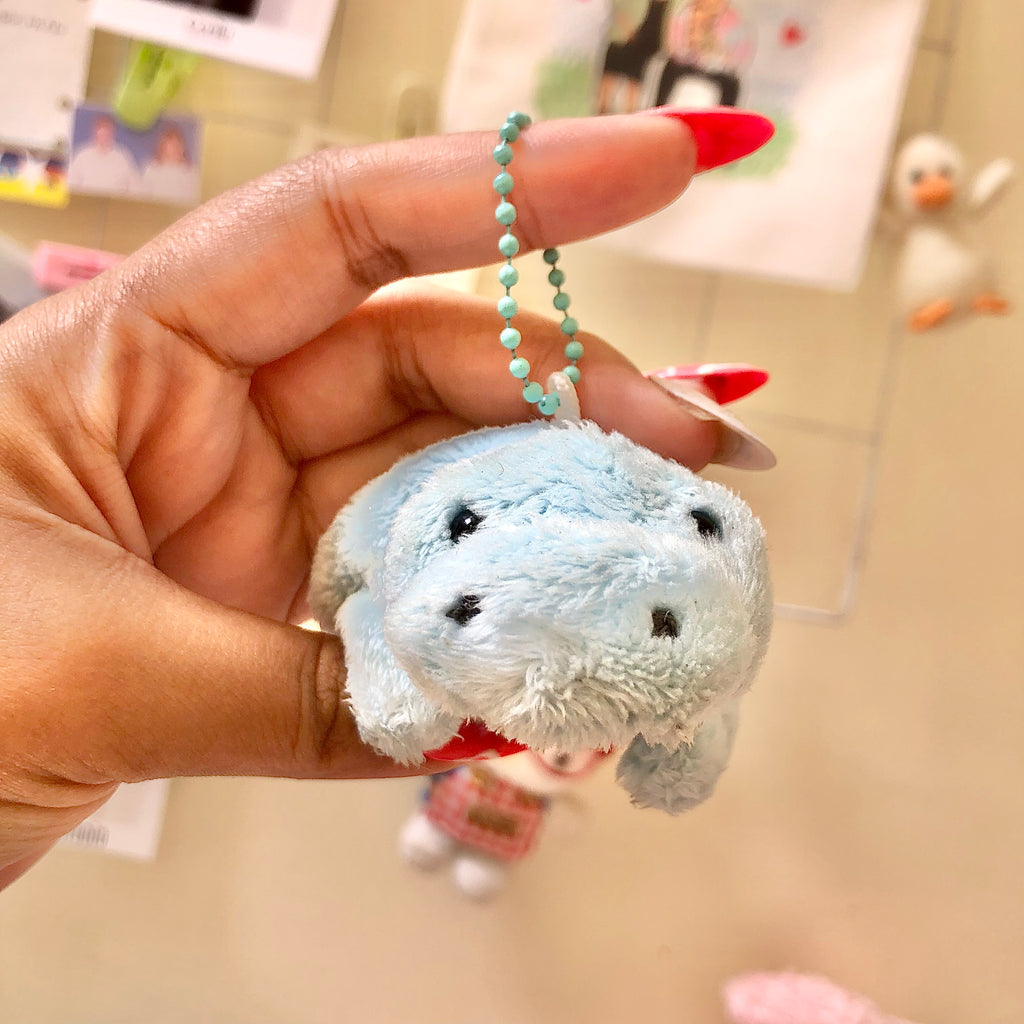 Back view of Colorata manatee plush showing Colorata label tag