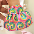 Front view of colorful tie-dye mini skirt on doll showing rainbow swirl pattern