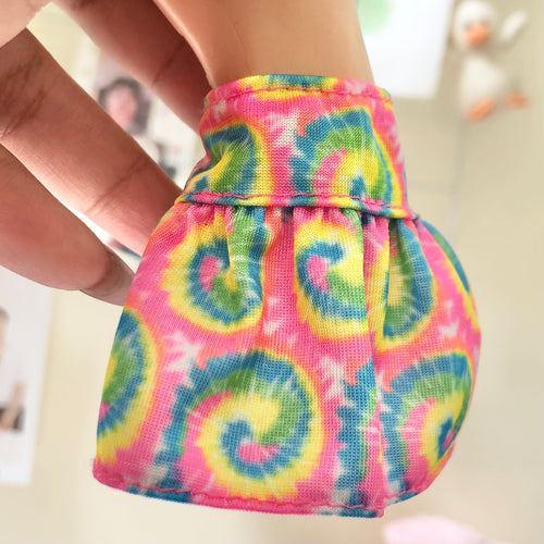 Back view of tie-dye doll skirt showing gathered waist and full skirt detail